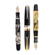 Load image into Gallery viewer, Uncapped Montegrappa Chinese Zodiac Dog fountain pens in gold and silver overlay, featuring intricate dog engravings on black resin bodies, displayed on a white background.