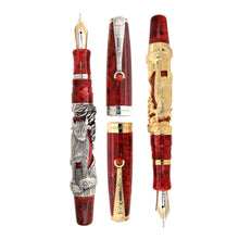 Load image into Gallery viewer, Uncapped Montegrappa Chinese Zodiac Ox fountain pens in gold and silver overlay, featuring intricate Ox engravings on red resin bodies, displayed on a white background.