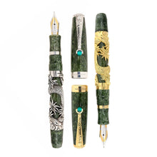 Load image into Gallery viewer, Uncapped Montegrappa Chinese Zodiac Snake fountain pens in gold and silver overlay, featuring intricate Snake engravings on green resin bodies, displayed on a white background.