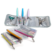 Load image into Gallery viewer, The six pouches arranged with the main carrying case.