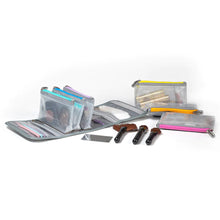 Load image into Gallery viewer, The carrying case, and six pouches arranged with cosmetics and accessories.