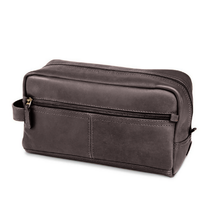 Load image into Gallery viewer, Angled front view of the brown leather toiletry bag.