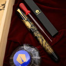 Load image into Gallery viewer, Capped fountain pen displayed with Namiki packaging, dropper, and blue inkwell.