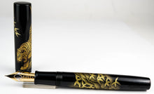 Load image into Gallery viewer, Uncapped fountain pen on a white background.