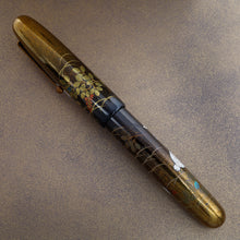Load image into Gallery viewer, The image shows the Rabbit on Moonlight pen with it's cap on the barrel at a different angle.