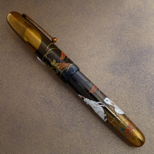 Load image into Gallery viewer, The image shows the Rabbit on Moonlight pen with it's cap on the barrel at a different angle. Both rabbits can be seen.