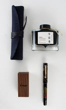 Load image into Gallery viewer, The Hoteison fountain pen arranged on a white background with the back ink bottle, small wooden box, and pen case.