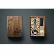 Load image into Gallery viewer, The fountain pen arranged with the pen sleeve, ink bottle, and the engraved wood presentation box.
