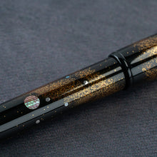 Load image into Gallery viewer, Close up to the pen barrel. Set on a textured gray background