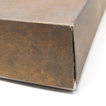 Load image into Gallery viewer, Close up to an edge of the outer box. A tear can be seen.