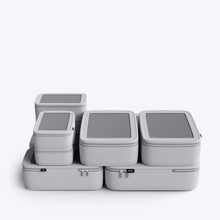 Load image into Gallery viewer, The pack of six silver packing cases arranged in a white background