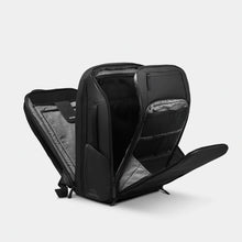 Load image into Gallery viewer, The black backpack with the three compartments unzipped.