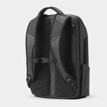 Load image into Gallery viewer, Angled back panel view of the black backpack.