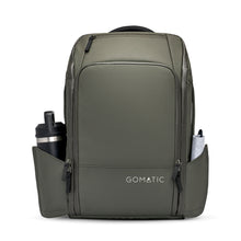 Load image into Gallery viewer, Front panel view of the olive green backpack with accessories arranged on the side panel pockets.