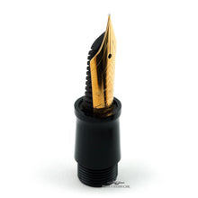 Load image into Gallery viewer, Fountain pen nib with gold tip and black body on a white background