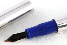 Load image into Gallery viewer, Back view of the fountain pen grip section and a the bottom part of the cap.