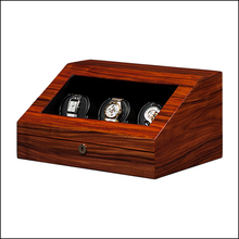Load image into Gallery viewer, A wooden watch winder box with a rich reddish-brown wood grain finish, featuring a glass top window displaying three watch positions with hands-wind watches inside, set against a plain white background.