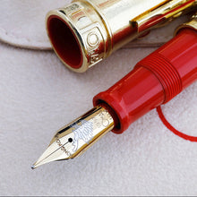 Load image into Gallery viewer, Close up to the fountain pen's nib with engraved text and decorations: HONG KONG, a dragon, 1997, Omas, 18K.