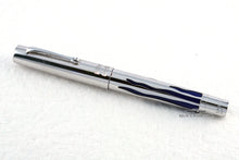 Load image into Gallery viewer, A side view of the pen is shown. The body is made of sterling silver, and the barrel features a blue design meant to represent the flames of a menorah.