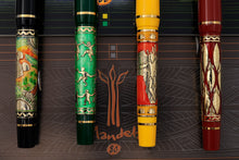 Load image into Gallery viewer, Close up to the pen bodies on the fountain pens, featuring golden accents and designs.