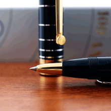 Load image into Gallery viewer, Close up to the rollerball grip section with the cap behind it.