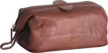 Load image into Gallery viewer, Angled front view of the brandy leather travel kit.