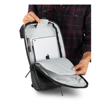 Load image into Gallery viewer, Interior view of the black sling bag with a tablet in the main compartment.
