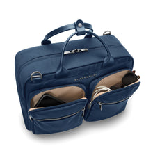 Load image into Gallery viewer, Briggs & Riley Rhapsody Multi-Pocket Cabin Bag shown in Navy
Front Angled View with two spacious front zip pockets to accommodate those travel essentials you need for quick access, such as smart phone reading or sunglasses, cables, etc.
Dimensions: 10.5 x 16.75 x 8.75 in / 26.7 x 42.5 x 22.2 cm