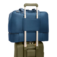 Load image into Gallery viewer, Briggs & Riley Rhapsody Weekender Tote - Shown in Navy
Image of Back Panel Attachment Feature, which allows this bag to ride along the telescoping handle of your carry-on trolley bag.
Dimensions: 15 x 19 x 9.8 in / 38.1 x 48.3 x 24.9 cm