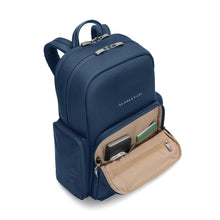 Load image into Gallery viewer, Briggs & Riley Rhapsody Medium Backpack - Shown in Navy
Side Panel View, showing front zip pocket, with quick access to your business accessories, such as pens, cards, passport, airline ticket. charger cables, etc.
Dimensions: 16 x 13.5 x 6 in / 40.6 x 34.3 x 15.2 cm