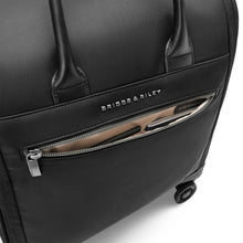 Load image into Gallery viewer, Briggs & Riley Rhapsody Wheeled Cabin Bag - Shown in Black
Image of Front Panel Zip Pocket with quick access to cards, passport, airline ticket, etc.
Dimensions: 16 x 14 x 8.5 in / 40.6 x 35.6 x 21.6 cm (includes wheels and handles)