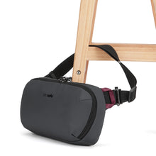Load image into Gallery viewer, Angled view of the black sling bag attached to a chair