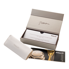 Load image into Gallery viewer, The Pelikan product packaging with a box, case, and brochure on a white background.