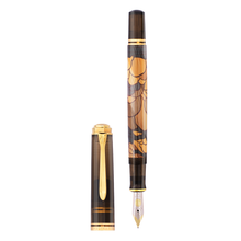Load image into Gallery viewer, Uncapped fountain pen with decorative could design on a white background.