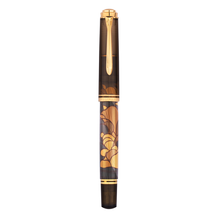 Load image into Gallery viewer, Capped fountain pen with decorative brown and gold clouds on a white background.