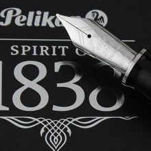 Load image into Gallery viewer, Close up to the fountain pen nib with engraved decorations and text: 1939 - 2018 Pelikan, 18C-750, M