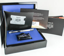 Load image into Gallery viewer, The fountain pen arranged with the presentation box, booklets, and ink bottle on a white background.