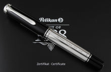 Load image into Gallery viewer, Front view of the pen. The barrel has engraved text: 180 YEARS PELIKAN 1838-2018.