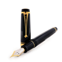 Load image into Gallery viewer, A Pilot Custom Black Urushi fountain pen with a gold lacquer finish, displayed with its cap removed to show the two-toned gold nib.