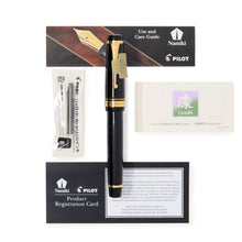Load image into Gallery viewer, Front view of the Fountain Pen with the cap on. It is arranged with the included documents and ink cartridge.