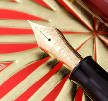 Load image into Gallery viewer, Close Up to the Nib. There is a delicate engraving on it featuring decorations, then "#3776", followed by the letter "P", then 18K for the material. Underneath, there is a small decoration engraved.