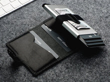 Load image into Gallery viewer, Interior view of the wallet with credit cards and cash tucked in the compartments.