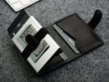 Load image into Gallery viewer, Interior view of the wallet with credit cards and cash arranged inside the compartments.