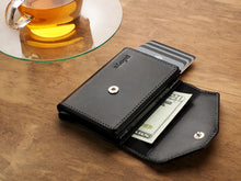 Load image into Gallery viewer, Angled view of the lack wallet with the with the flap opened.