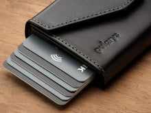 Load image into Gallery viewer, Close up to six credit cards peeking from the side of the wallet.