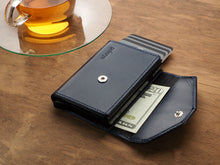 Load image into Gallery viewer, Interior view of the navy wallet with credit cards and a bill tucked in the compartments.