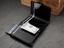 Load image into Gallery viewer, Interior view of the black wallet with credit cards and a $100 bill tucked inside.