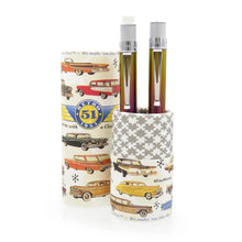 Load image into Gallery viewer, The Retro 51 Chromatic Gift set on a white background. The pen and pencil are placed on the gift tube bottom, which serves as a stand. The design of each gift tube different. This one has various vintage cars.