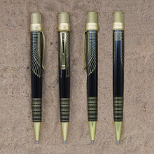 Load image into Gallery viewer, Front, back, and side views of The Retro 51 Cleopatra rollerball pen. Shown on a sandy background.