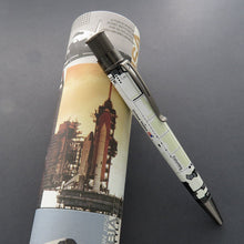 Load image into Gallery viewer, Side view of the Columbia Space Shuttle pen leaning on the gift tube.